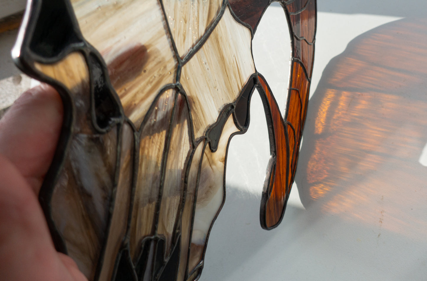 Gothic goat skull stained glass close-up — hand-cut glass pieces, eerie bone detail, witch halloween horror decor, Kyiv artist