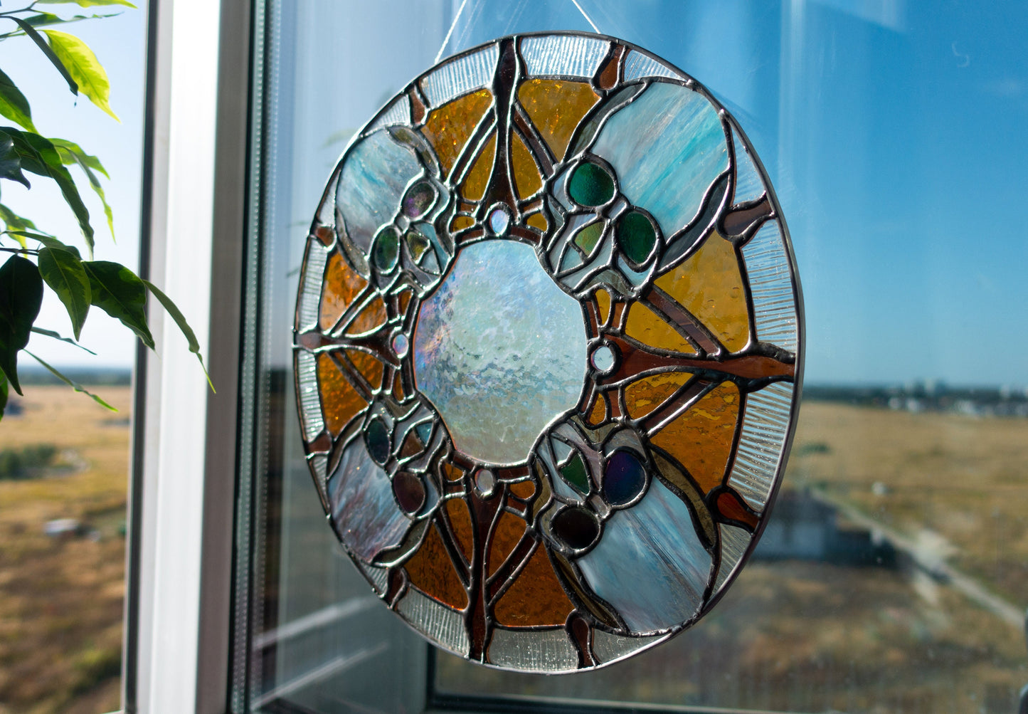 Round skull stained glass panel hanging in window — spooky Halloween decor, unique gothic gift, Mojoartglass