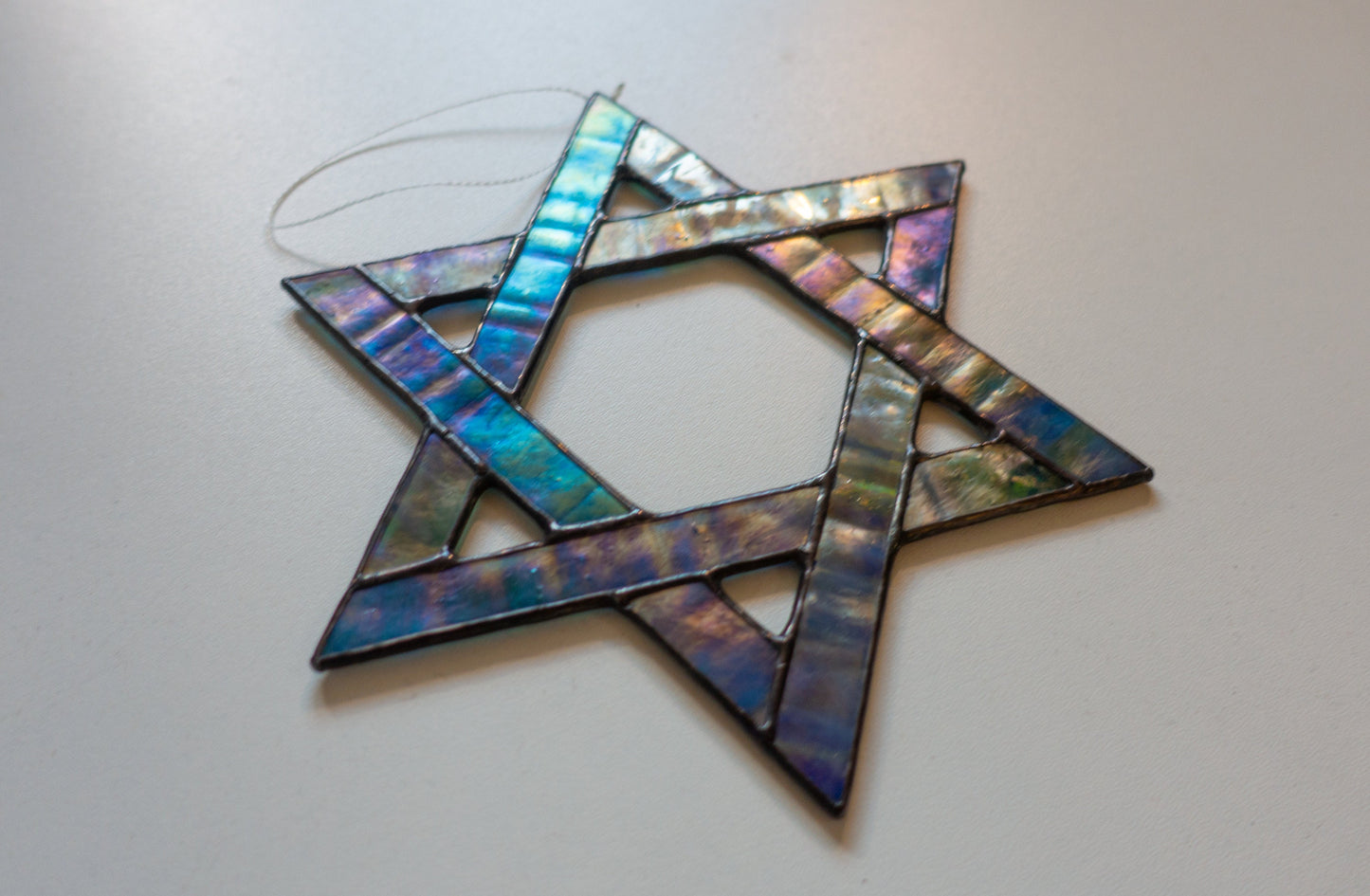 Star of David suncatcher hanging in window — colorful light catcher, meaningful Hanukkah gift