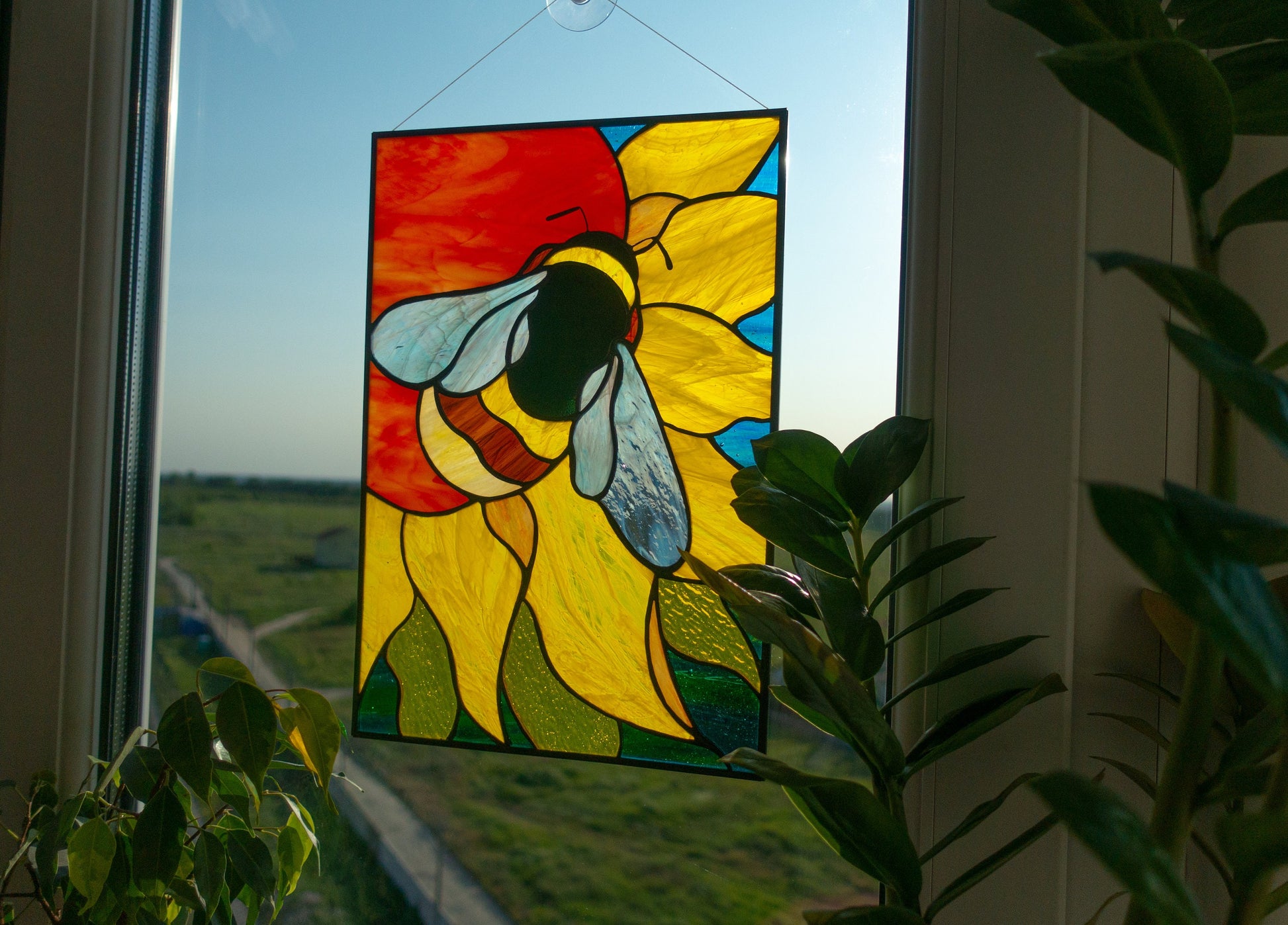Honeybee on sunflower stained glass — golden amber petals, copper foil Tiffany method, made in Ukraine