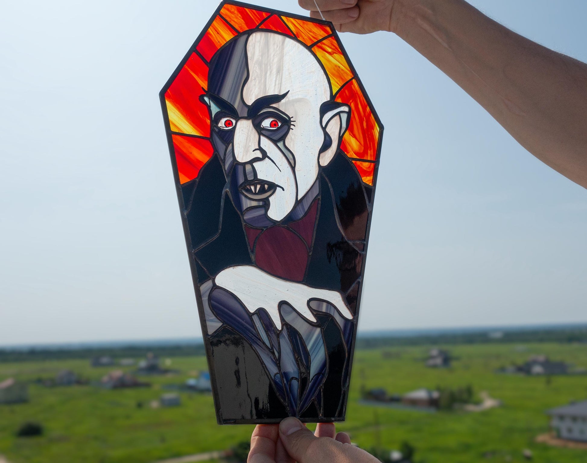 Nosferatu stained glass close-up — dramatic shadow detail, black patina finish, hand-cut glass silhouette