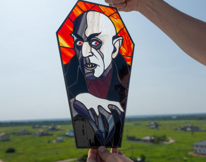 Nosferatu stained glass close-up — dramatic shadow detail, black patina finish, hand-cut glass silhouette