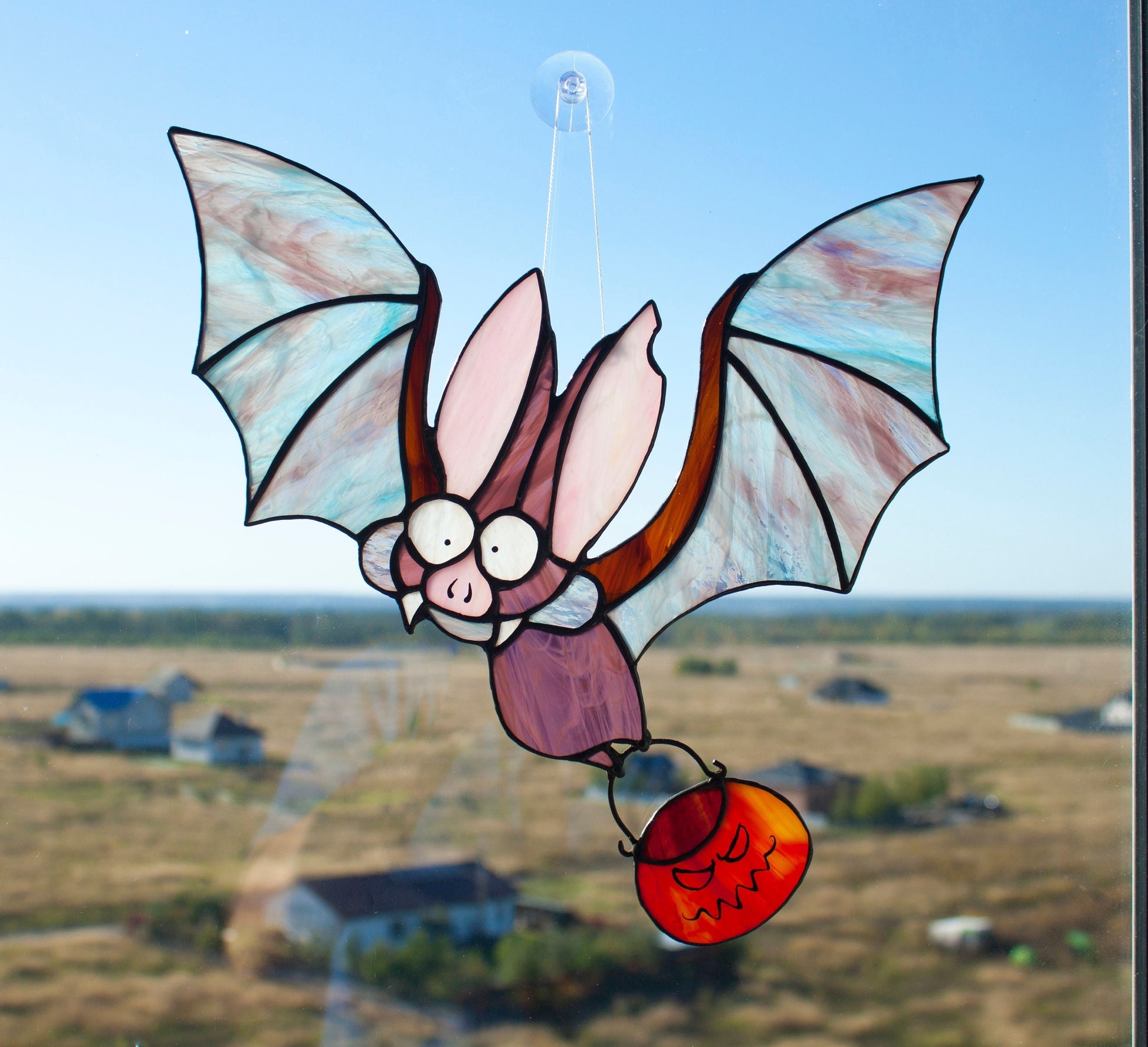 Gothic bat carrying glowing pumpkin stained glass — copper foil Tiffany method, made in Ukraine

