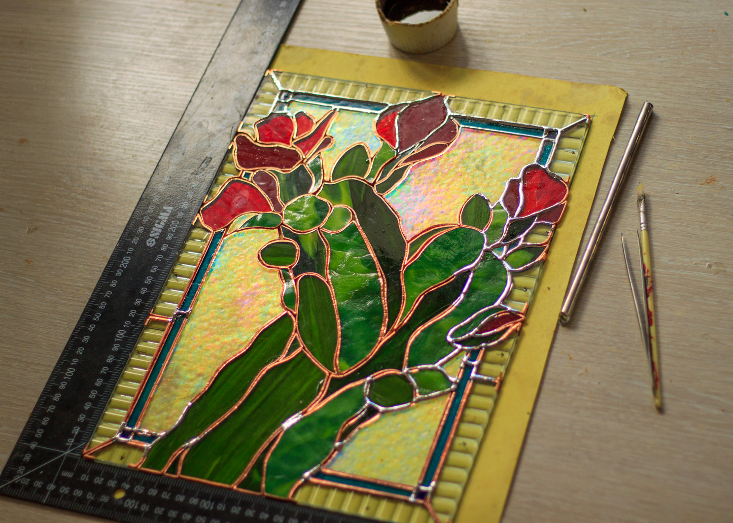 Stained glass cactus panel in progress — copper foil Tiffany technique, handmade studio process, Mojoartglass