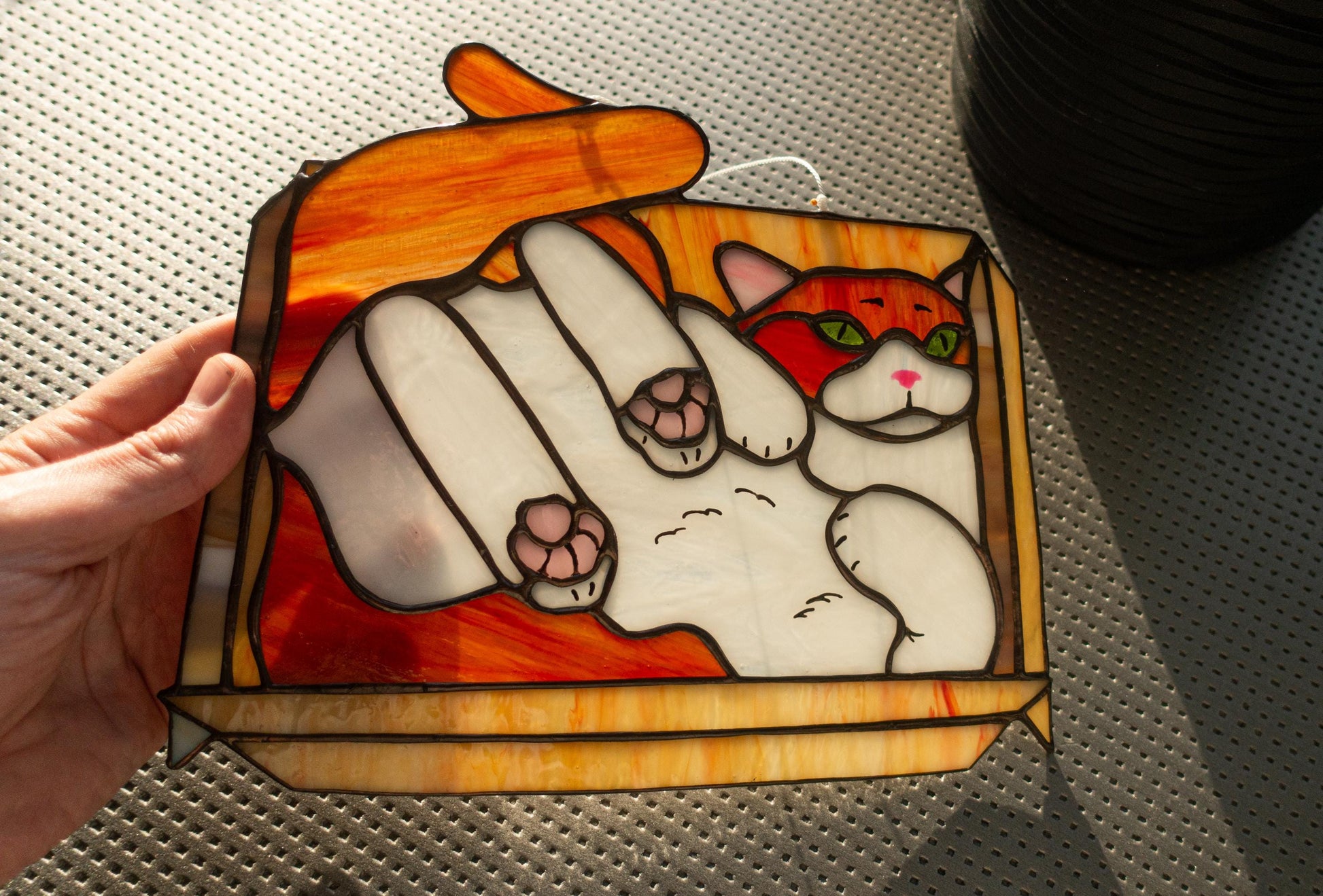 Handmade stained glass cat sitting in box — copper foil Tiffany technique, colorful meme art, made in Ukraine