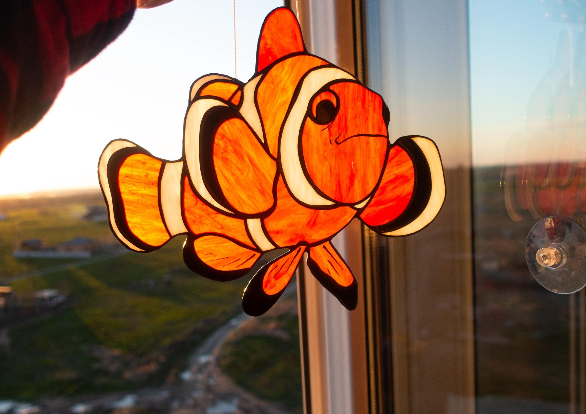 Handmade clownfish stained glass suncatcher — tropical orange fish coral reef window art ocean nature gift