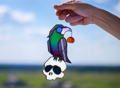 Handmade stained glass Halloween crow on skull suncatcher — gothic raven window art, Mojoartglass

