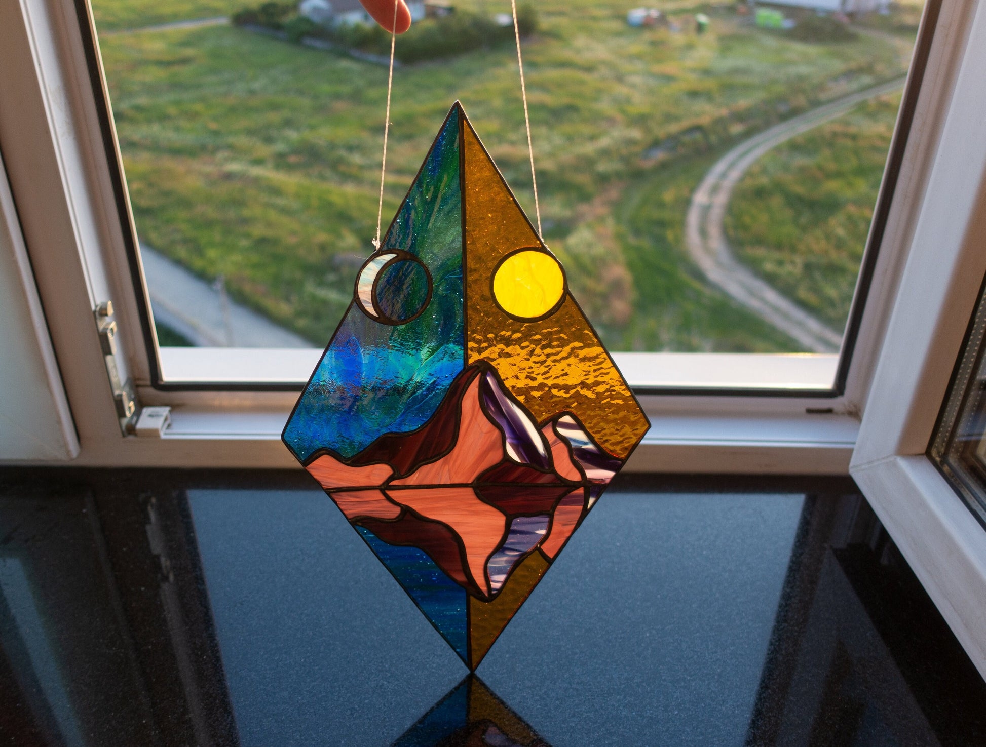 Handmade day and night mountain stained glass rhombus suncatcher — geometric nature window art decor