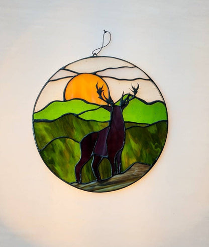 Stained glass deer panel close-up — silhouette detail, black patina finish, hand-cut round glass