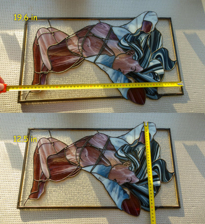 Two sizes of stained glass female figure panels measured side by side — 19.6 in and 12.5 in wide, reclining nude in purple and blue glass, size comparison photo