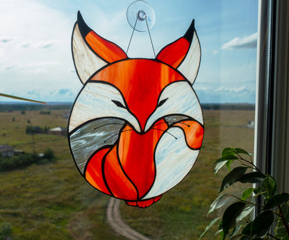 Stylized fox curled in circle stained glass — warm amber orange glass, copper foil Tiffany method, Ukraine

