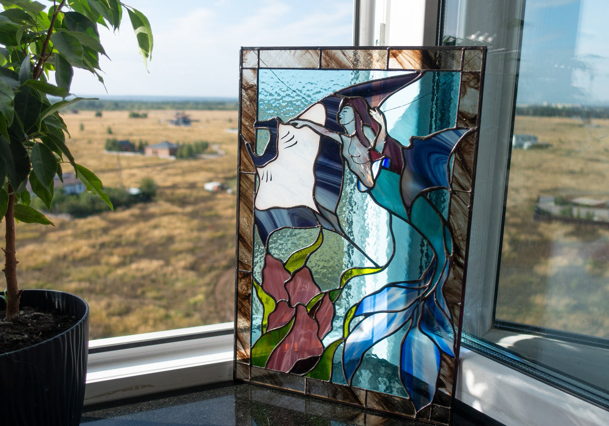  Stained glass mermaid and stingray ocean panel standing on windowsill with plant, blue and teal glass with purple coral and green seaweed, made in Ukraine