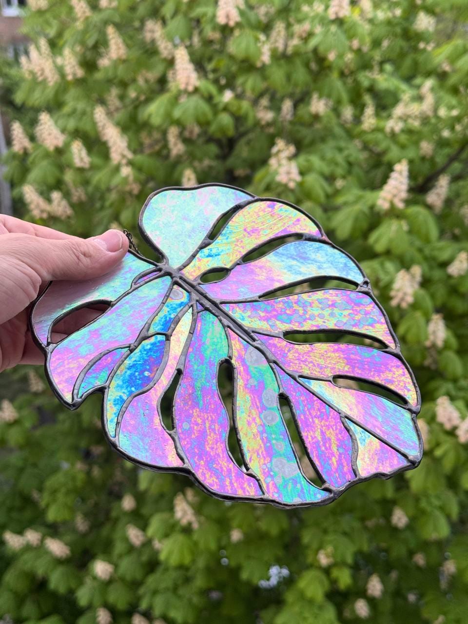 Handmade iridescent stained glass monstera leaf — copper foil Tiffany technique, shifts green teal gold, made in Ukraine