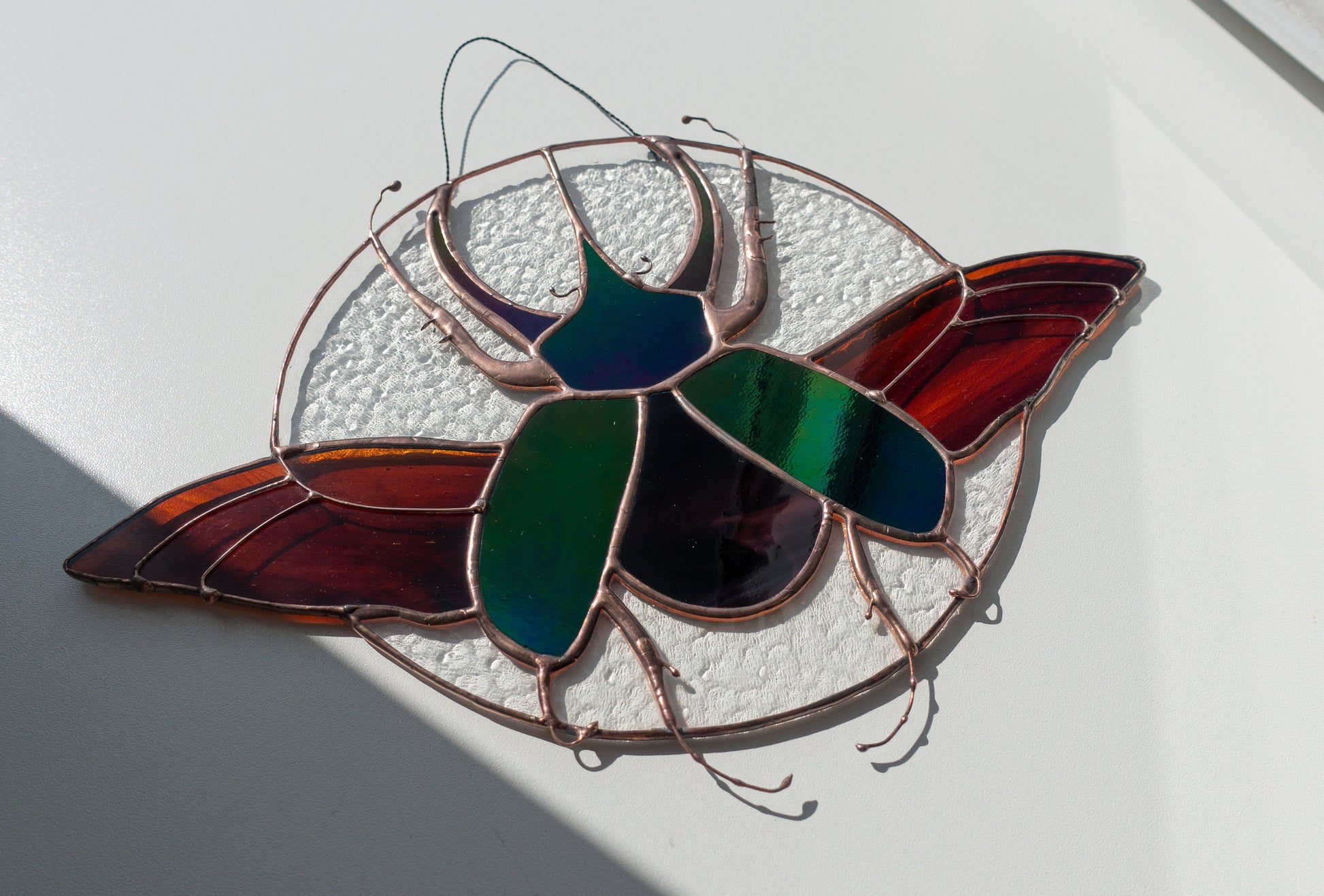 Stained glass rhinoceros beetle suncatcher — handmade scarab insect window art decor