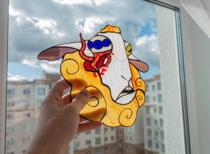 Handmade surreal sheep suncatcher hanging in window — dark fantasy glass art, unique weird home decor