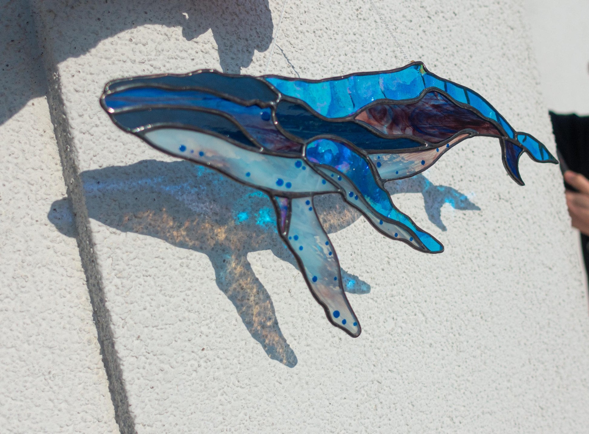 Tiffany copper foil stained glass whale detail — deep blue ocean glass, hand-cut pieces
