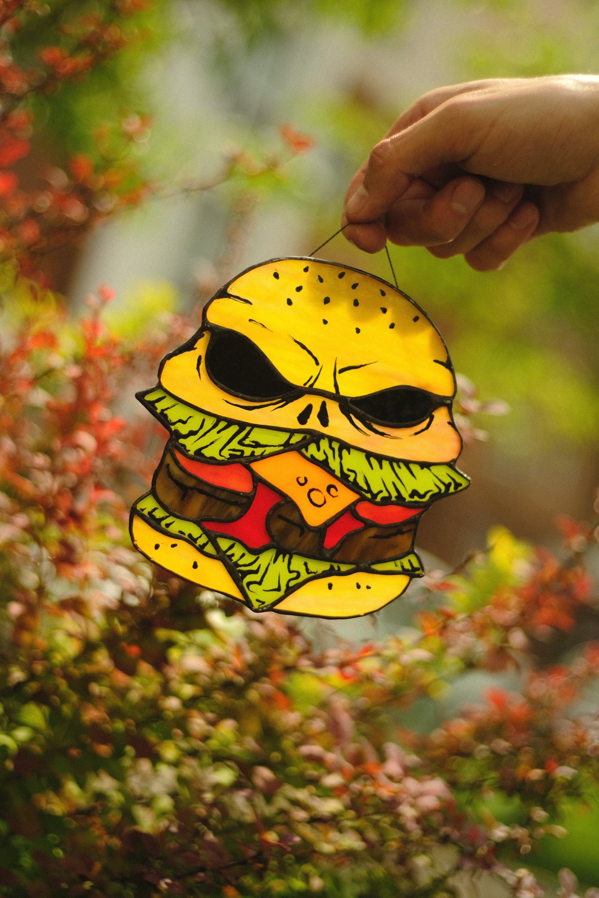 Halloween zombie burger stained glass suncatcher — skull food horror window art weird spooky gift